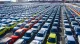 Rows of Chinese electric vehicles at a port awaiting export