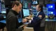 Traders work on the floor of the New York Stock Exchange