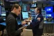 Traders work on the floor of the New York Stock Exchange